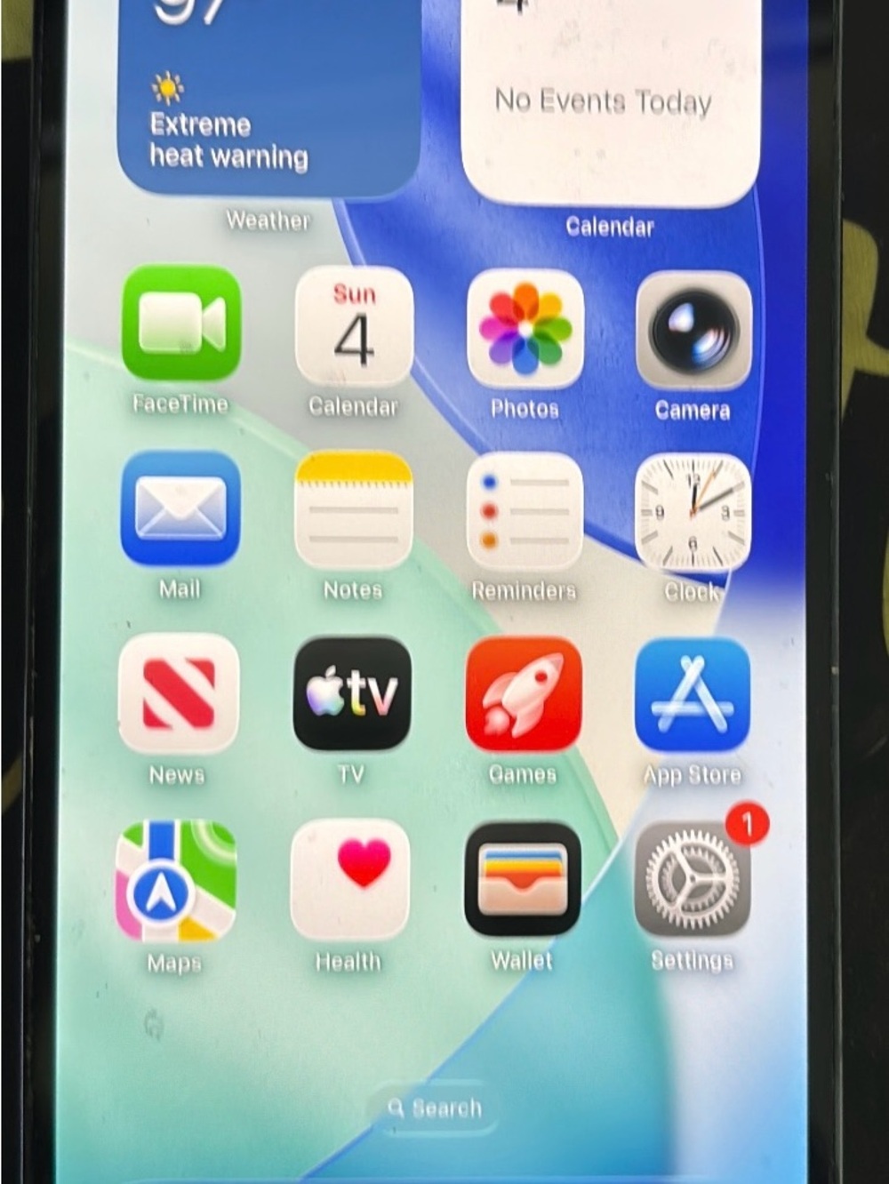 Apple iPhone in Silver with Colorful iOS Home Screen